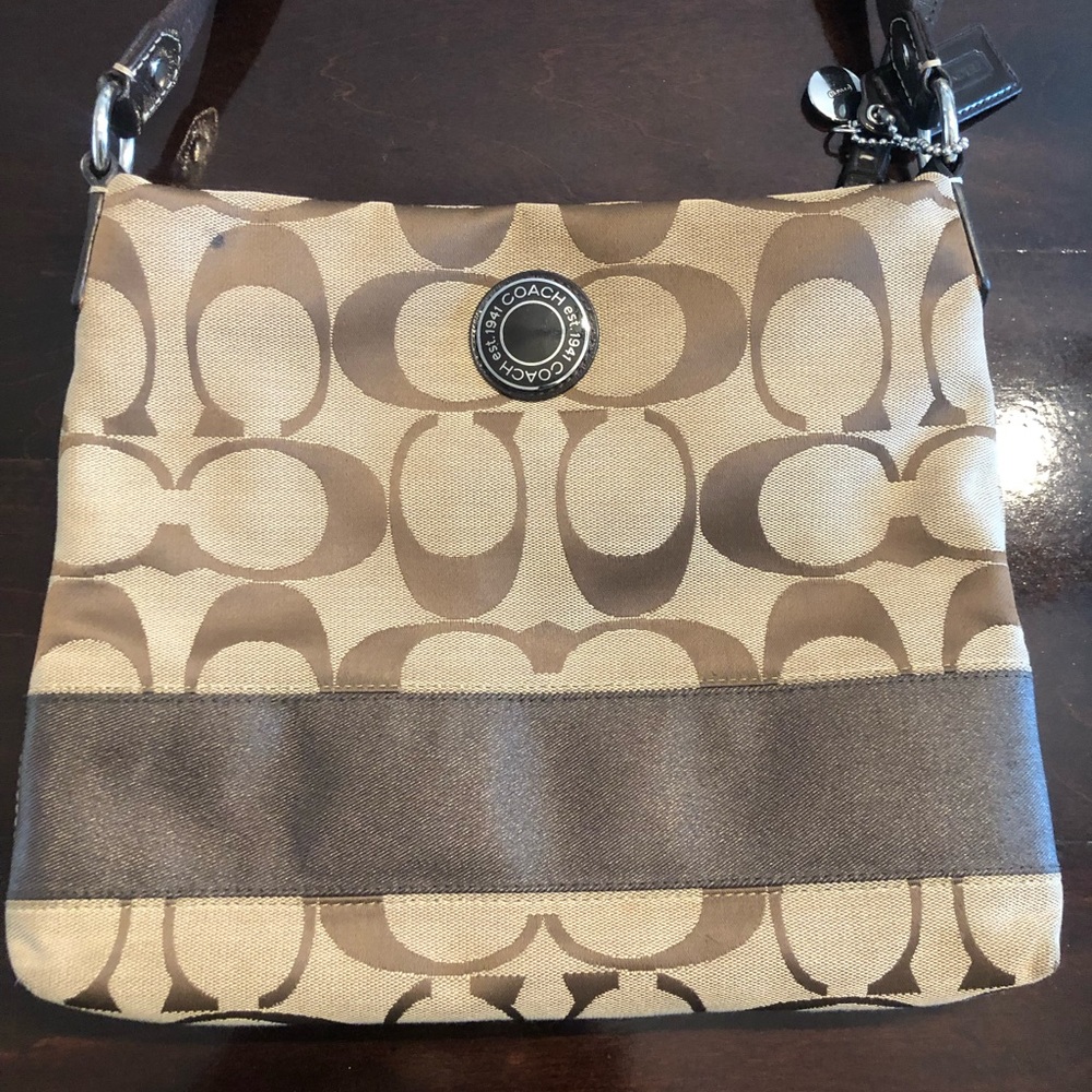 Coach monogram  crossbody bag.  Its in good condition .
